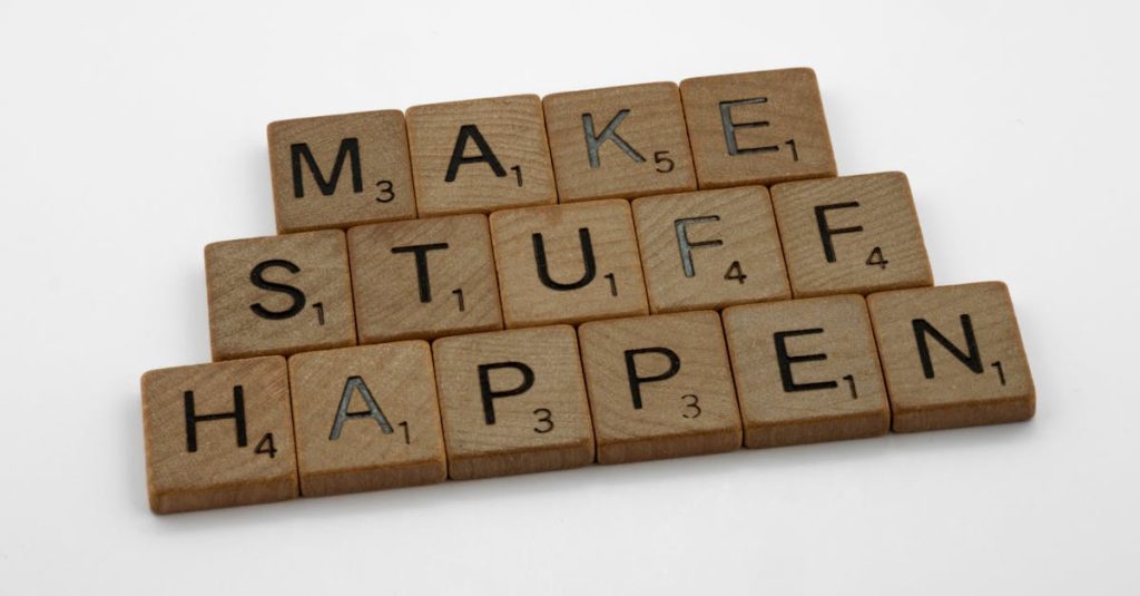Motivational quote 'Make Stuff Happen' created with scrabble tiles on a clean white background.